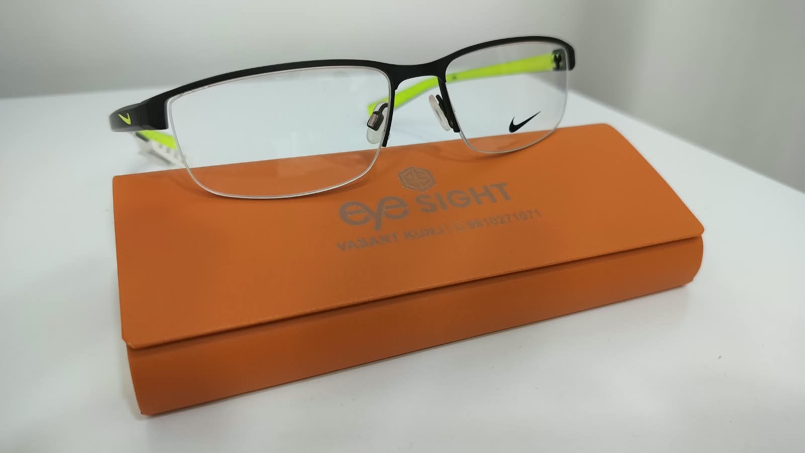 Nike black and volt half-rim frame at Eye Sight