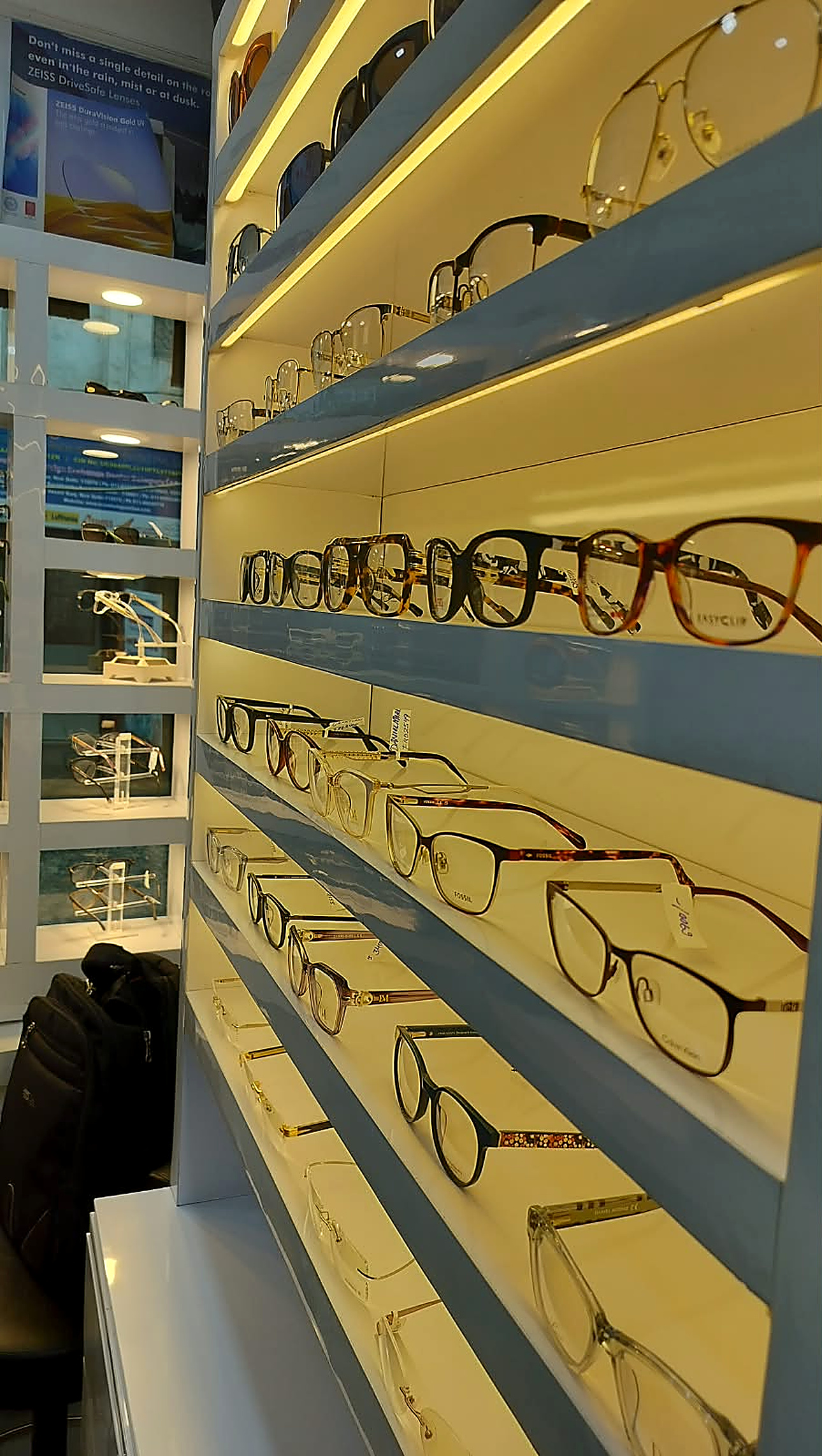 Illuminated shelves of premium eyeglasses at Eye Sight Vasant Kunj