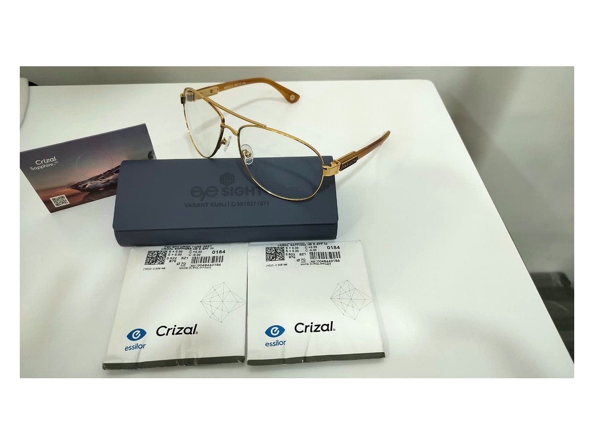 Gold optical frame with Crizal lens packaging at Eye Sight